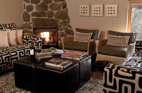 Cozy Lounge with Fireplace at Tshukudu Bush Lodge, Luxury Accommodation at Pilanesberg Game Reserve - Accommodation Bookings